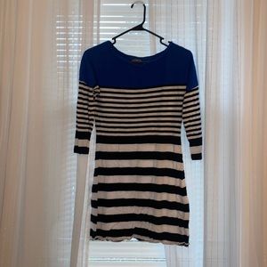 Black, white, and blue short dress with long sleeves